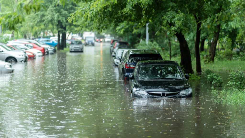 Flooded cars on the street of the city.