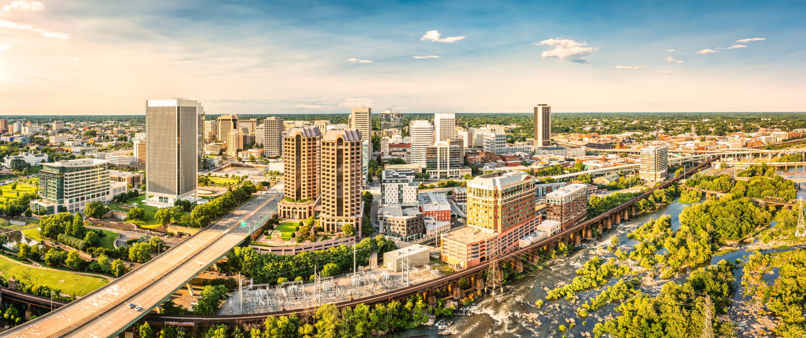 Aerial panorama of Richmond, Virginia, at sunset. Richmond is the capital city of the Commonwealth of Virginia. Manchester Bridge spans James River