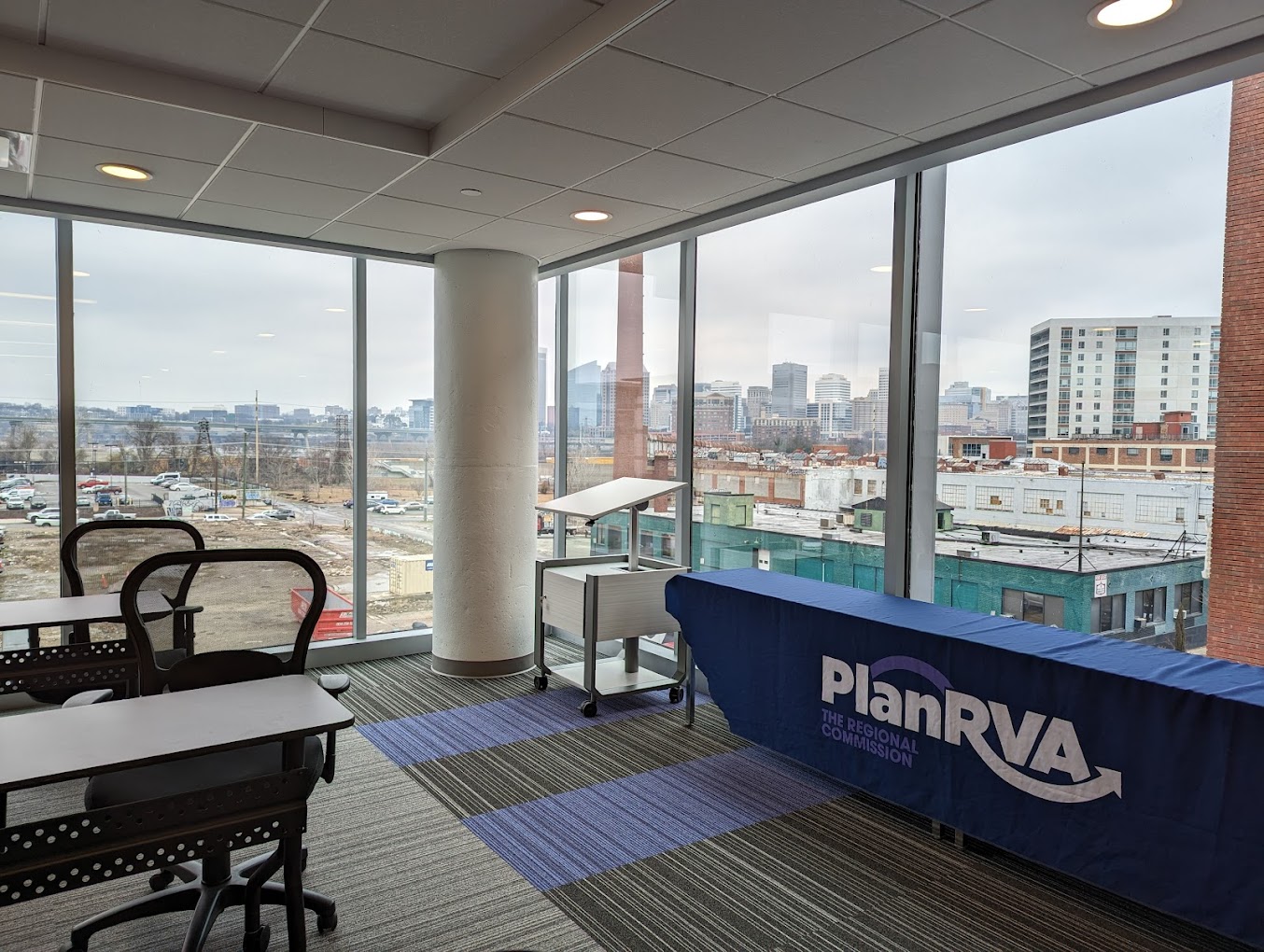 PlanRVA conference room overlooking the Richmond city skyline. 