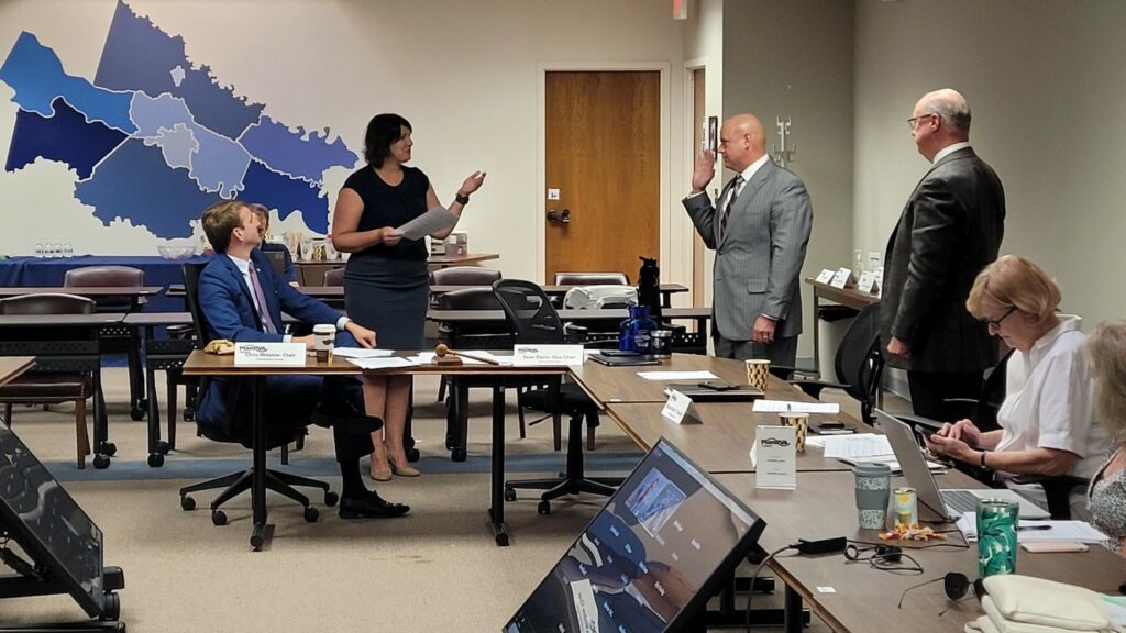Executive Director, Martha Heeter swears in Sean M. Davis (left) and Michael W. Byerly (right) to serve as PlanRVA Chair and Vice Chair for Fiscal Year 2023.
