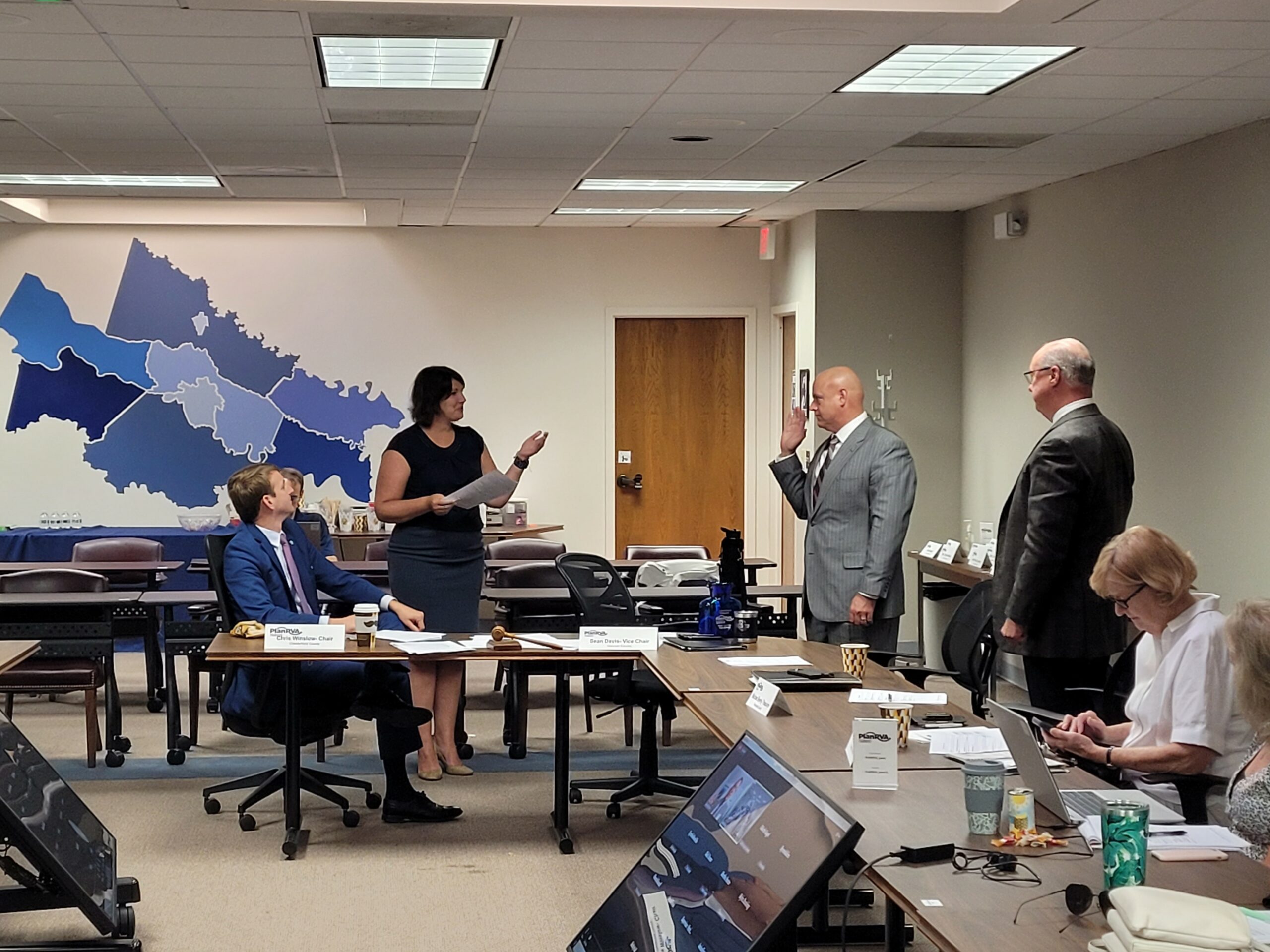 Executive Director, Martha Heeter swears in Sean M. Davis (left) and Michael W. Byerly (right) to serve as PlanRVA Chair and Vice Chair for Fiscal Year 2023.